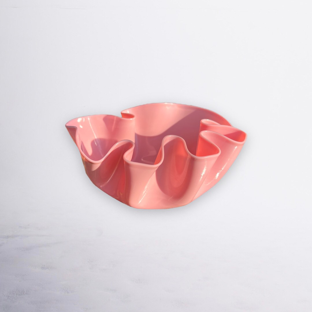 Pink bowl with flowing ruffled edges
