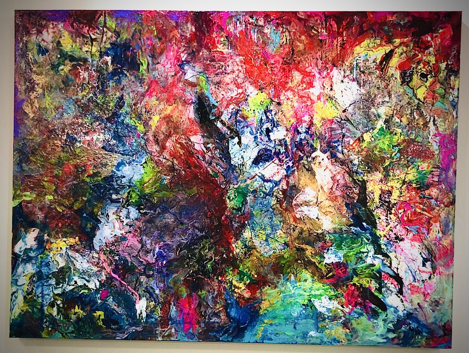 Framed abstract painting in red, blue, green, and white