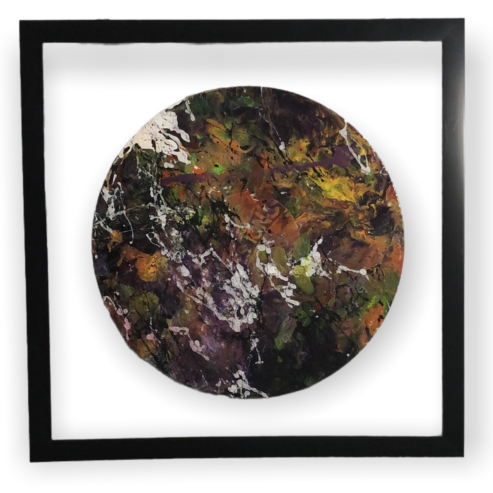 Abstract painted vinyl record in a black frame
